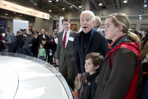 John O'Donnell, executive vice president, Washington Area New Automobile Dealers Association observes the vice president's reaction as he looks at the 2015 Corvette.
