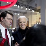 John O'Donnell, executive vice president of WANADA gets a smile out of vice president Joe Biden.  Kevin Reilly, auto show chairman listens intently.