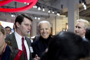 John O'Donnell, executive vice president of WANADA gets a smile out of vice president Joe Biden.  Kevin Reilly, auto show chairman listens intently.