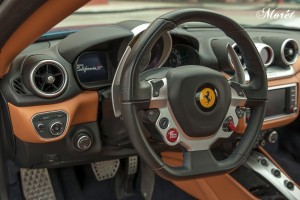 The new multi-function steering wheel looks like it was ripped out of a Formula1 car. The center infotainment system is angled vertically, as are the bank of HVAC controls. Below that is a reworked center console with buttons for reverse, automatic mode, and launch control. The huge paddle shifters shine brightly behind the flat-bottomed steering wheel. 